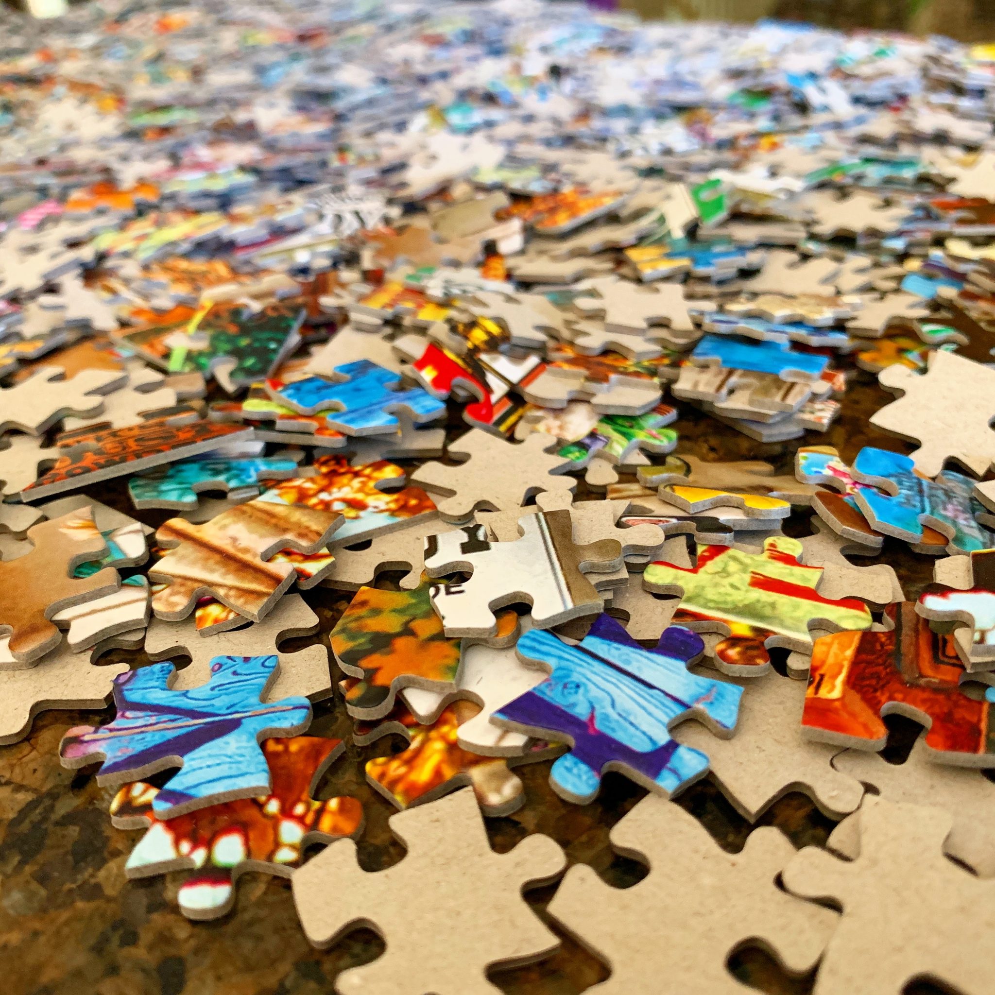 Close-up of a colourful jigsaw puzzle in progress
